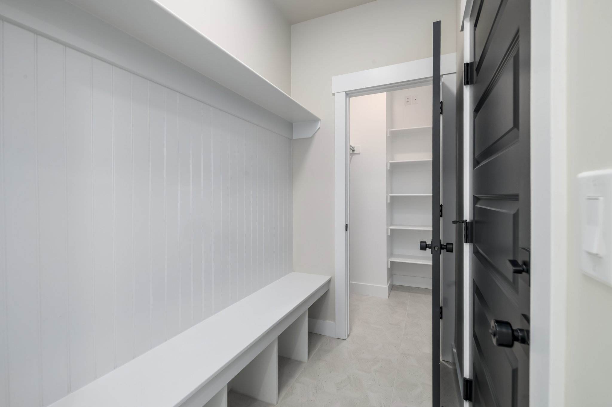 Mudroom featuring light tile patterned floors