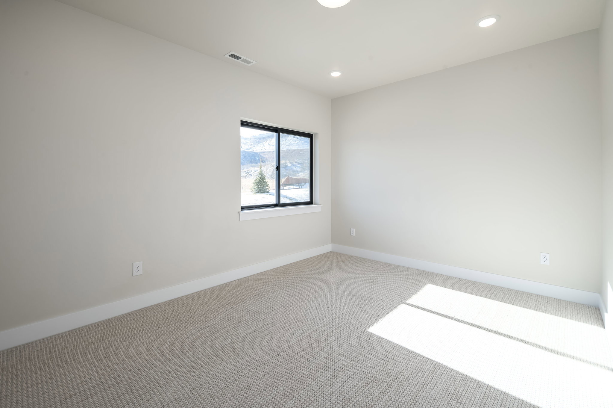 Unfurnished room with light carpet and recessed lighting