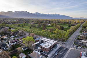 Aerial view of residential area featuring a mountainous background