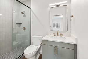 Bathroom with vanity and a shower stall