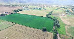 Aerial view of property's location with rural landscape and abundant farmland