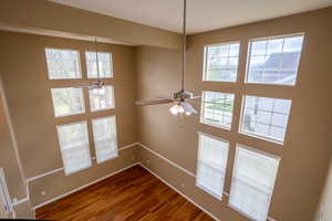 Interior space featuring wood finished floors and a ceiling fan