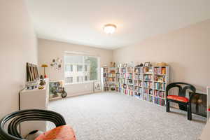 Living area with carpet floors and baseboards