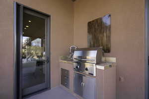 View of patio featuring area for grilling