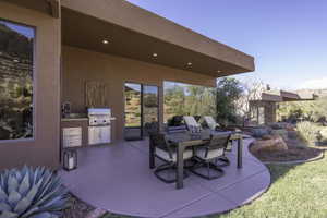 View of patio featuring an outdoor kitchen / dining area
