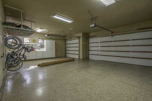 Garage featuring a garage door opener