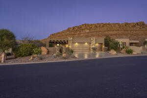 View of front of house featuring an attached garage and driveway