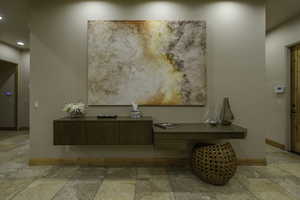 Detailed view of baseboards and recessed lighting