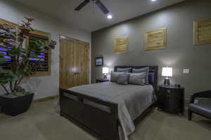 Bedroom featuring a closet, light colored carpet, recessed lighting, and ceiling fan