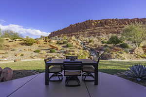 View of patio / terrace with outdoor dining area and a mountain view