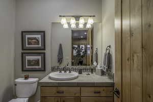 Bathroom featuring vanity and toilet
