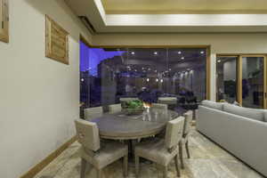 Dining space featuring stone tile flooring
