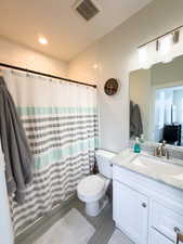 Full bathroom with vanity, a shower with shower curtain, and recessed lighting