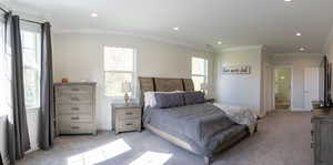 Bedroom featuring crown molding, light colored carpet, recessed lighting, and ensuite bathroom