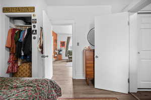 Bedroom featuring a closet and light wood finished floors
