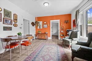 Dining space featuring light wood-style floors and baseboards