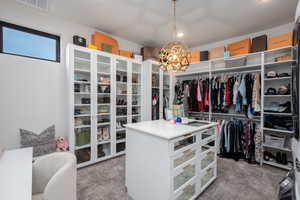 Walk in closet featuring carpet floors