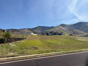 View of mountain background featuring rural landscape