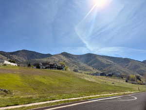 View of mountain backdrop featuring rural landscape