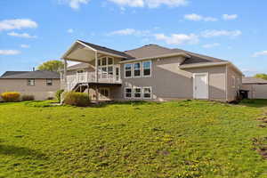 Back of house featuring stairway and stucco siding
