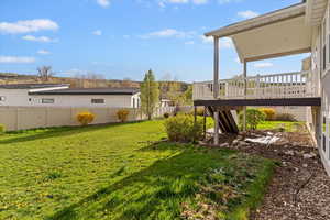Fenced backyard with a deck and stairway