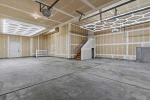 Garage featuring a garage door opener