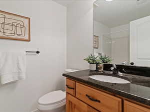Full bathroom with vanity and a shower