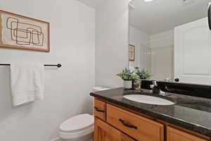 Bathroom featuring vanity and a shower