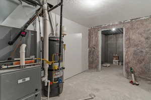 Utilities with heating unit, water heater, and drainage system