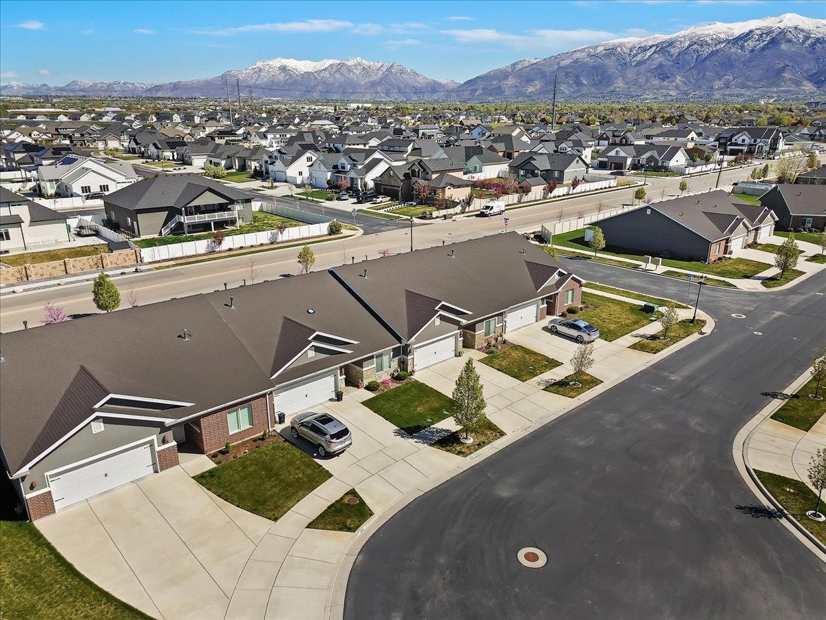 Aerial perspective of suburban area featuring a mountainous background