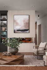 Living room with wood finished floors and recessed lighting