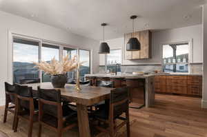 Dining room featuring dark wood-type flooring, recessed lighting, and a mountain view