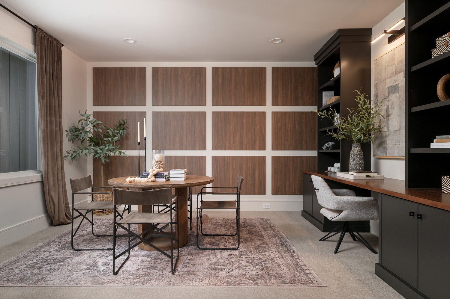 Home office featuring built in desk and light colored carpet