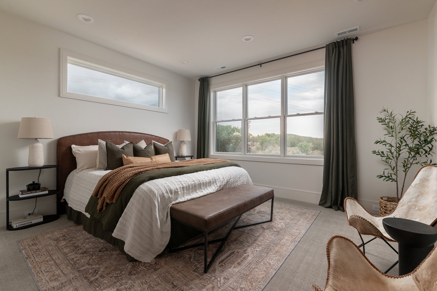 Bedroom featuring light colored carpet and baseboards