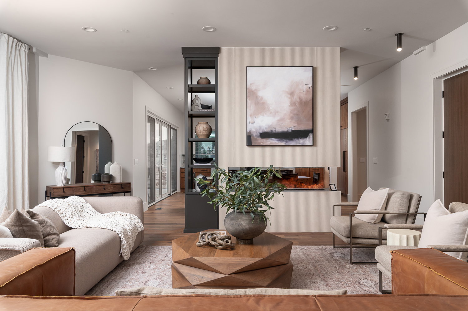 Living area with wood finished floors and recessed lighting