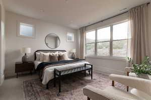 Bedroom featuring baseboards and carpet flooring