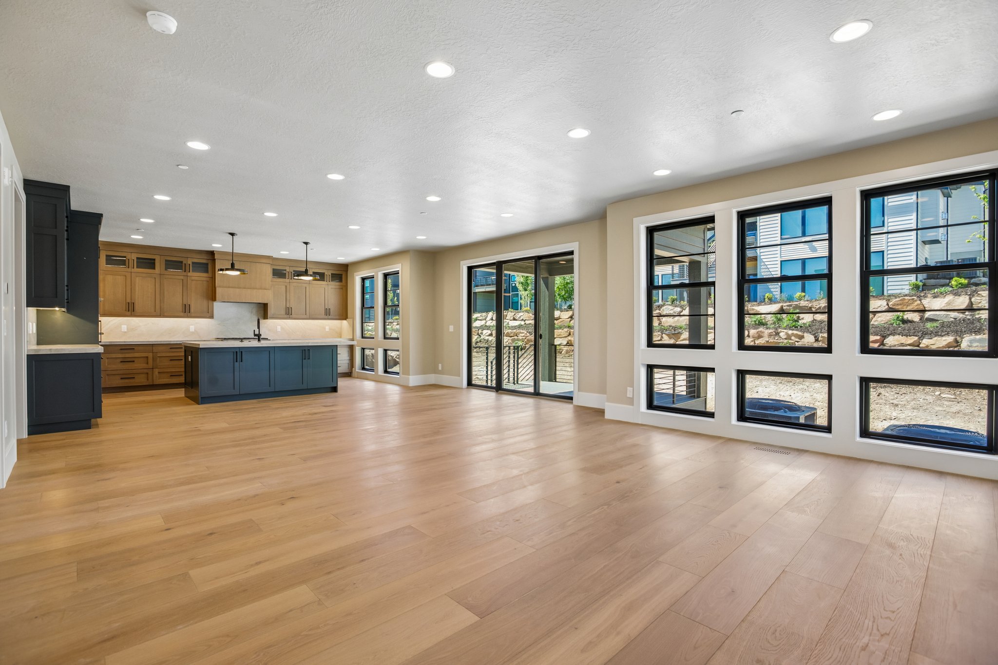 Open-concept living area featuring light wood-finish flooring