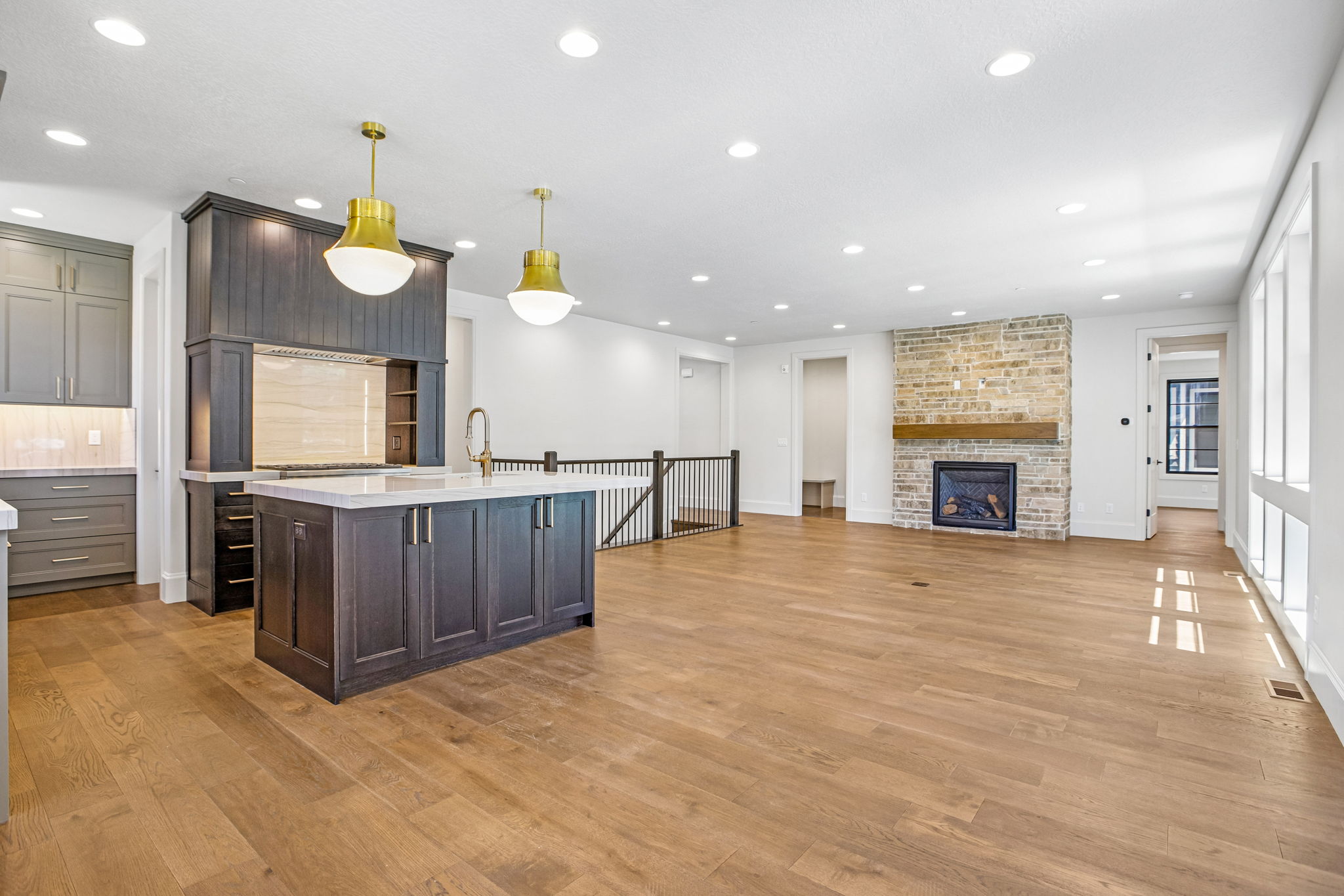 Open-concept living area with wood-finish flooring