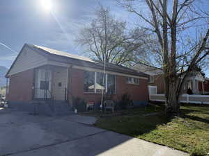 View of front of property featuring brick siding