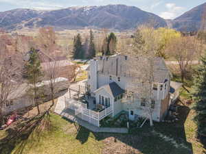 View of subject property with a mountain backdrop