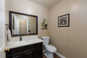 Half bath with vanity and toilet