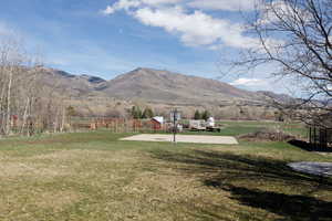 View of mountain backdrop with rural landscape