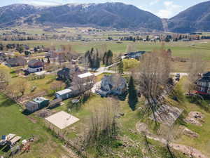 Aerial view of residential area featuring a mountainous background