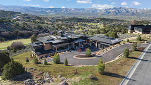 View from above of property with a mountain backdrop