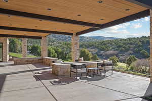 View of patio / terrace with a mountain view