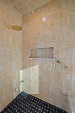 Bathroom featuring a tile shower