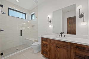Bathroom with vanity, a stall shower, and light tile patterned flooring