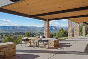 View of patio / terrace with a mountain view and exterior kitchen