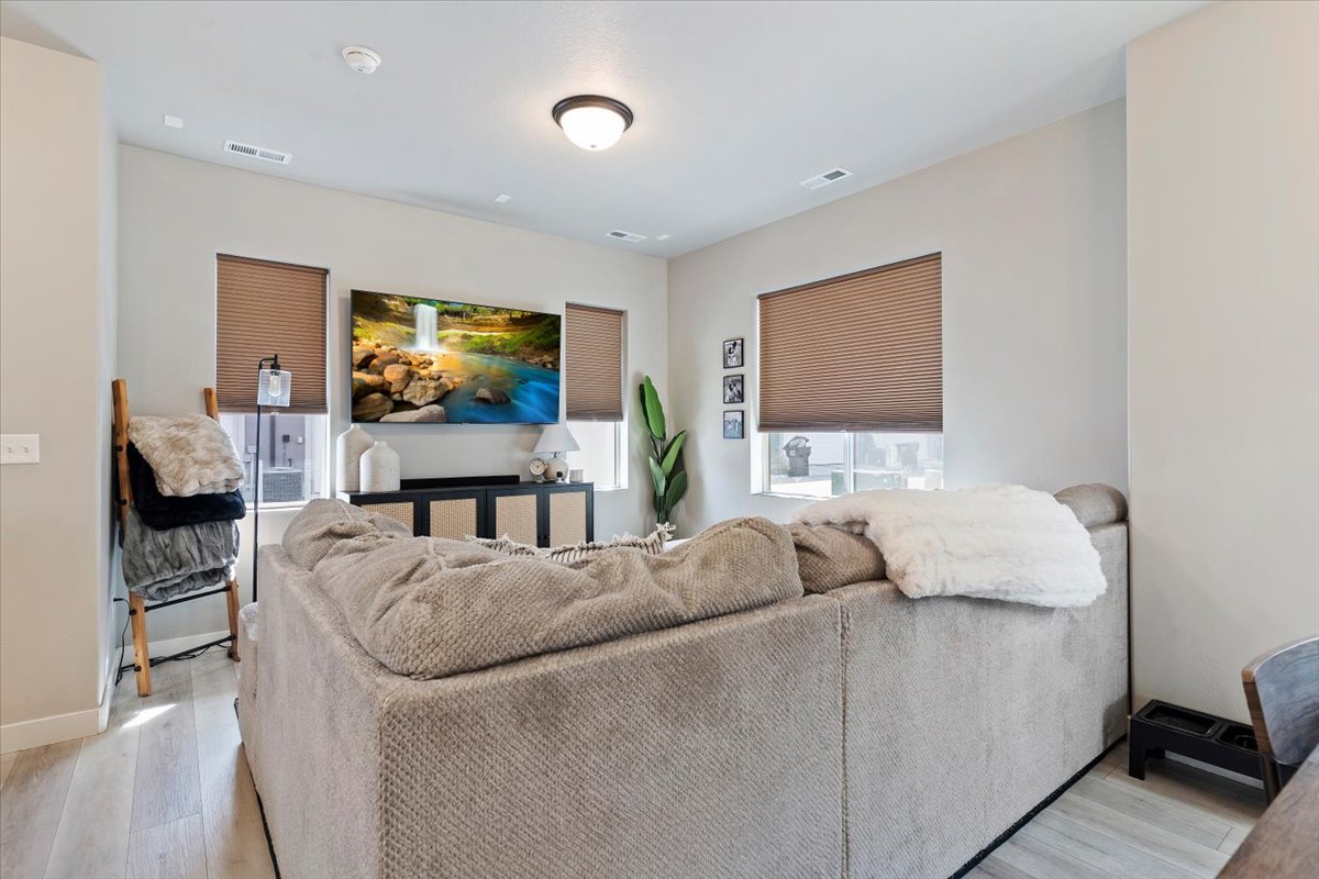 Living room with light wood-type flooring