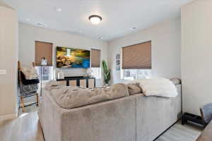 Living room with light wood-type flooring